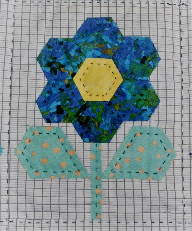 quilt avec fleurs en english paper piecing