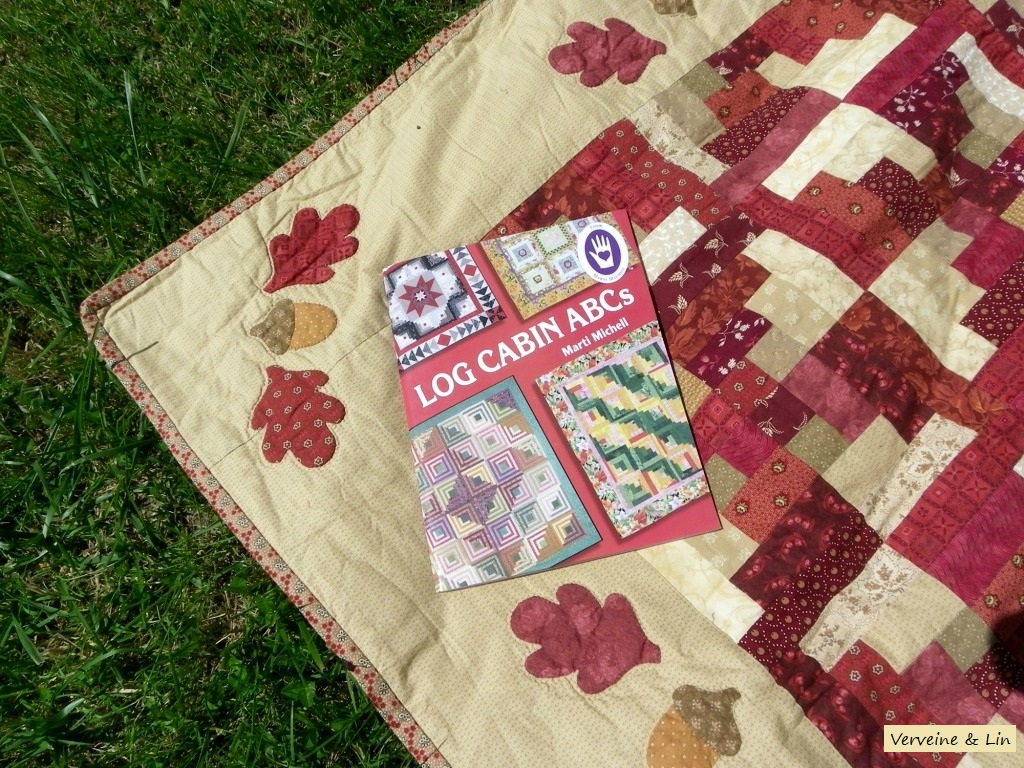 quilt en log cabin avec bordure en appliqué