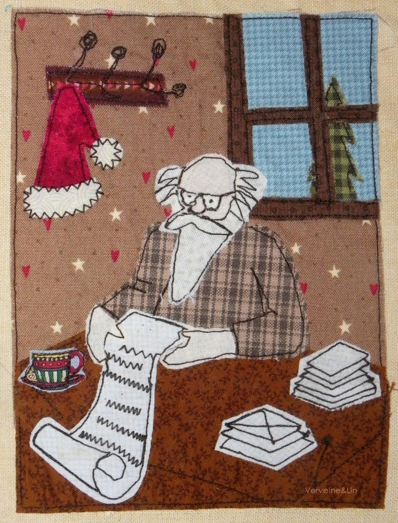 livre textile Le Village du père Noël
appliqué collé et broderie free motion