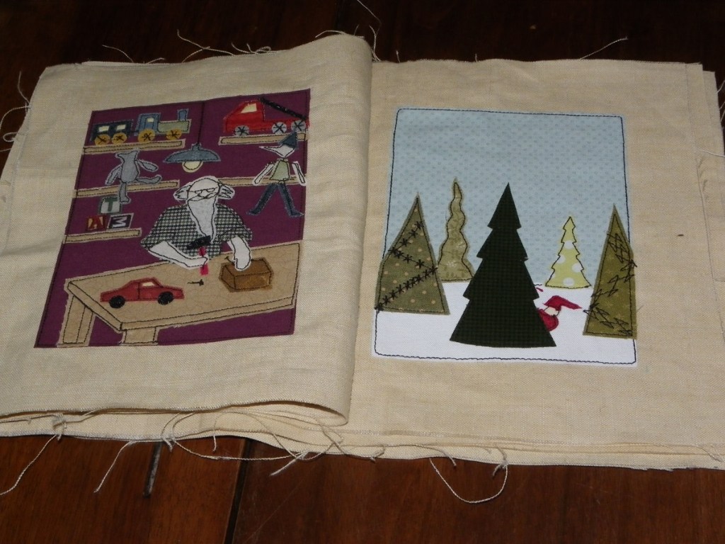 livre textile Le Village du père Noël
appliqué collé et broderie free motion