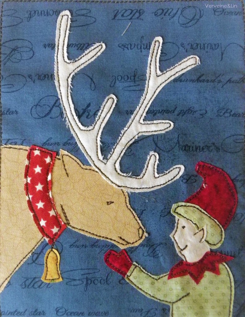 livre textile Le Village du père Noël
appliqué collé et broderie free motion