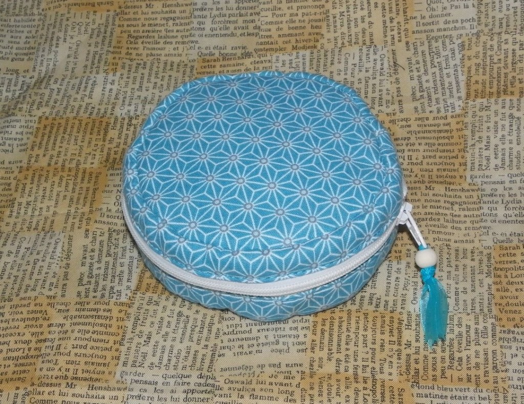 trousse ronde zippée pour ranger les bijoux