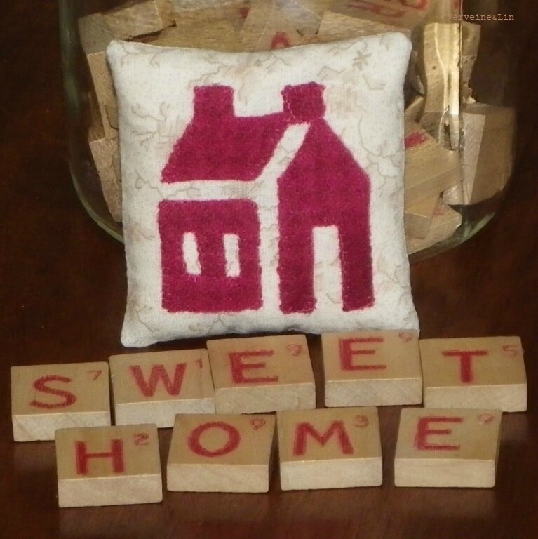 coussinet en appliqué de lainages