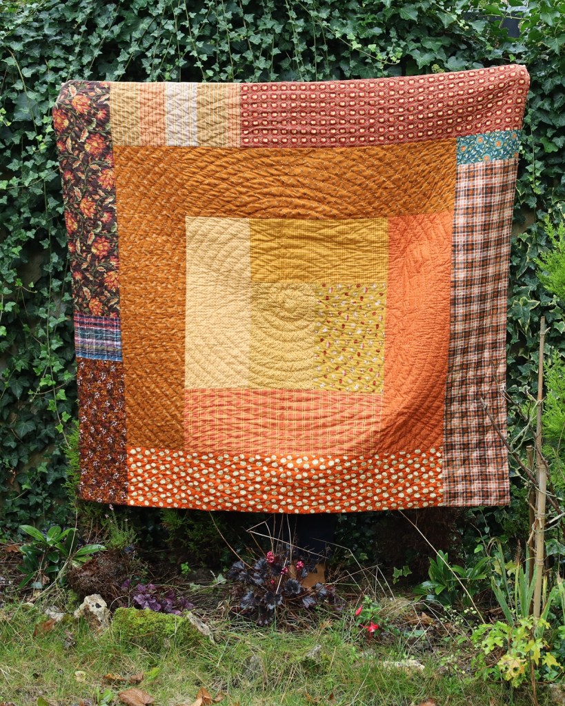 courtepointe d'automne en log cabin géant avec quilting en spirale au coton perlé