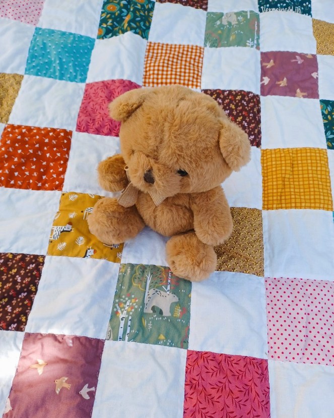 Checkerboard crib quilt
Couverture en patchwork pour bébé
